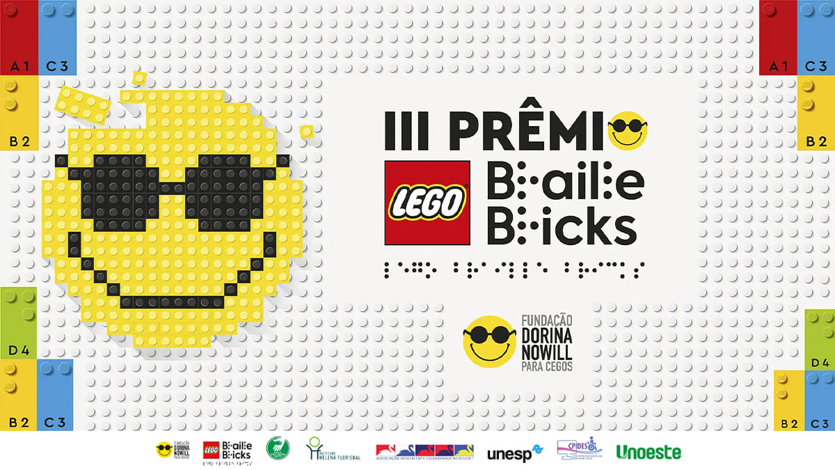 Painel com peças LEGO formando emoji sorridente com óculos escuros ao lado do título “III Prêmio LEGO Braille Bricks” e logotipo da Fundação Dorina Nowill para Cegos. (Créditos: Divulgação)